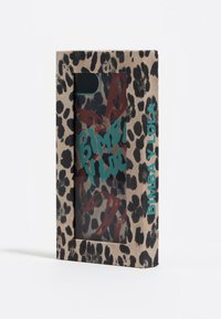Leopard print phone case packaging features a transparent window. It has bold red graphics and teal text that reads "BIMBA Y LOLA."