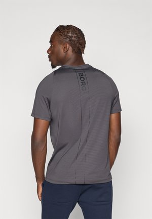Men's short-sleeve, dark grey athletic shirt with a textured finish and vertical black "BORG" logo on the back. Darts enhance fit design.