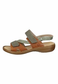 Tan and light green open-toe sandal with adjustable straps, cushioned insole, and a curved, light brown outsole.