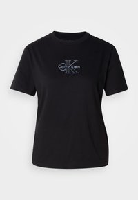 Zwarte katoenen t-shirt met een ronde hals. Voorzien van het witte grafische logo "Calvin Klein" en gestileerde "CK" op de voorkant. Korte mouwen, relaxte pasvorm.