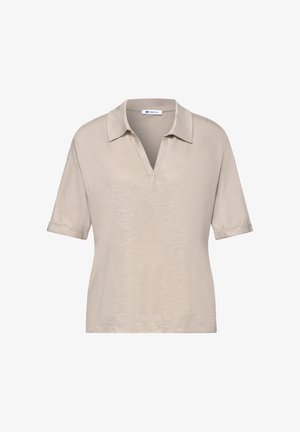 Beige lyhythihainen poolopaita V-kaula-aukiolla, leveällä kauluksella ja käännetyillä hihoilla, valmistettu kevyestä teksturoidusta kankaasta.