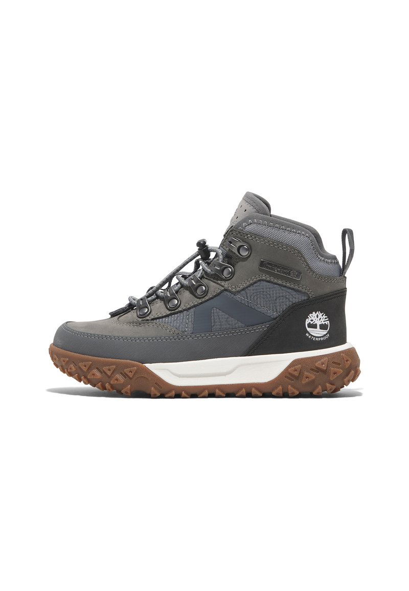 Gray hiking boots with a textured upper, waterproof design, contrasting black accents, and a rugged brown outsole with triangular treads.