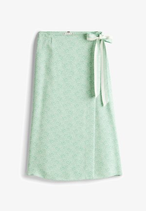 Heller grüner Rock mit einem durchgehenden weißen Wirbelmuster, seitlichem Schleifenakzent aus gestreiftem Stoff, glatte Textur, knielange Ausführung.