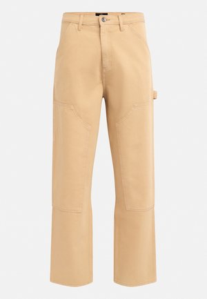 Beige Cargo-Hosen mit hoher Taille, weitem Bein und sichtbaren Nähten. Sie verfügen über große Seitentaschen und eine Gürtelschlaufe an der rechten Hüfte.