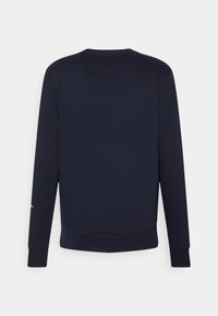 Felpa a maniche lunghe blu navy con polsini e orlo a coste, schiena liscia e un piccolo triangolo ricamato sul colletto.