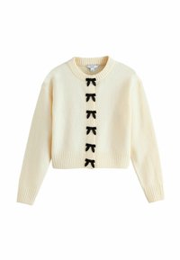 Cream-colored cropped sweater with ribbed hem and cuffs, featuring six black bow accents along the button closure. Soft texture.