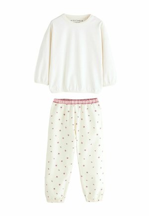 Kreminė ilgomis rankovėmis palaidinė su elastingomis apykaklėmis; atitinkančios kreminės kelnės su rožiniu gėlių raštu ir surinkta rožine juosmens linija. Minkšta audinio tekstūra.