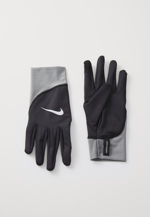 Black and gray Nike gloves with a fitted design, smooth texture, and a white logo on the back. Features a touchscreen-compatible fingertip.