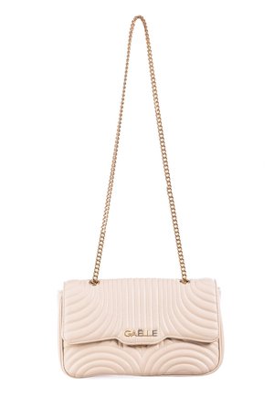 Beige quilted handbag with a gold chain strap, featuring a flap closure and embossed wavy pattern with a logo plaque on the front.