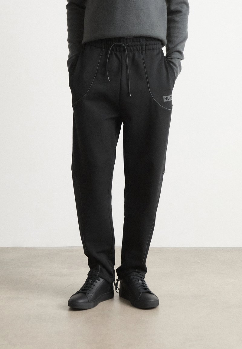 HUGO NIPIPEPANT - Tracksuit bottoms - black