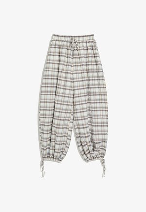 Losse geruite broek met elastische tailleband en aantrekkoorden bij de enkels, in beige, bruin en lichtblauwe tinten.