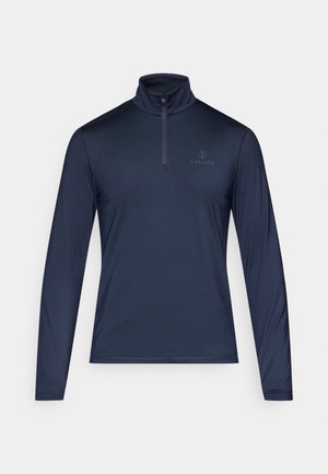 Tumed sinine piksärgiga pullover, millel on tõmblukuga kaelus, sile ja kerge kangas ning väike logo rinnal. Klassikaline stiil.