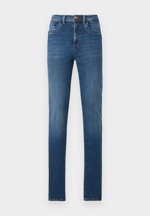 Jean slim bleu avec poches avant et arrière, fermeture par bouton, et légère décoloration sur les jambes, présenté sur un fond blanc uni.