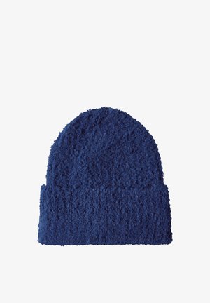 Berretto lavorato a maglia blu navy con una superficie testurizzata e pelosa e un bordo piegato nella parte inferiore. Progettato per offrire calore.