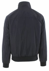 Giubbotto bomber nero con colletto alto, polsini elasticizzati e orlo a coste; realizzato in tessuto leggero e liscio di colore uniforme.