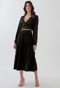 TUSSAH LAIDEY - Falda acampanada - black