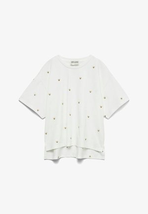 Biała, oversize'owa koszulka z miękkiego materiału, z małymi złotymi ilustracjami misiów równomiernie rozmieszczonymi na przodzie. Krótkie rękawy i luźny krój.