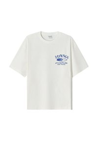 White cotton t-shirt with short sleeves. Features blue printed text and waves design on the left chest, highlighting "YUNAGI" and "SURF HOSTEL."