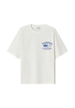 White cotton t-shirt with short sleeves. Features blue printed text and waves design on the left chest, highlighting "YUNAGI" and "SURF HOSTEL."