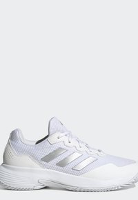 White athletic shoe with mesh upper, silver three stripes on side, padded collar, white laces, and textured sole for traction.