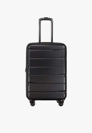 Black hard-shell suitcase with a textured surface, featuring a retractable handle and four wheels for mobility. Horizontal ridges accent the design.