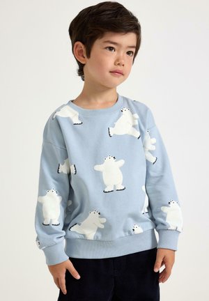 Ljusblå sweatshirt med vita isbjörnsillustrationer och svarta detaljer. Mjuk textur med ribbade muddarna och midjan.