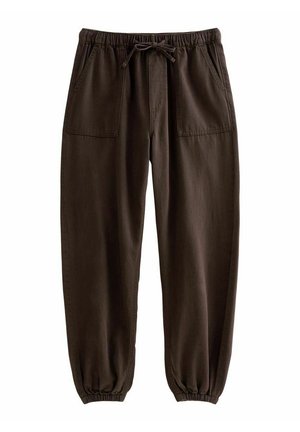 Pantalon de jogging en coton marron avec taille élastique, cordon de serrage, poches plaquées à l'avant et poignets élastiques aux chevilles.