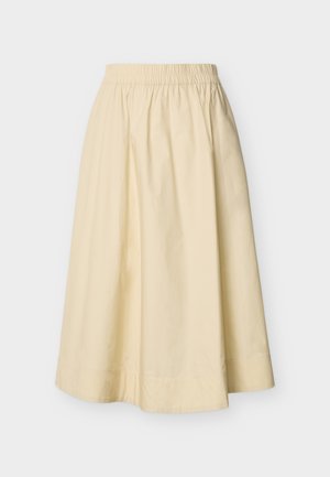Jupe midi de couleur crème avec ceinture élastique et silhouette évasée en A, présentée sur un fond uni.