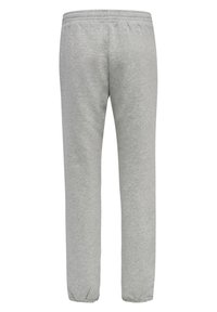 Lysegrå joggingbukser med elastisk taljebånd, tilspidsede ben og manchetter ved anklerne. Fremstillet af blødt, tekstureret stof. Simpelt design.