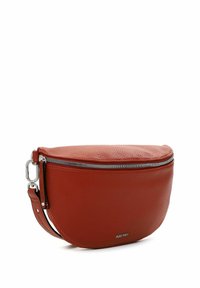 Red leather crossbody bag with a textured finish, oval shape, silver zip closure, and adjustable strap for versatile carrying options.