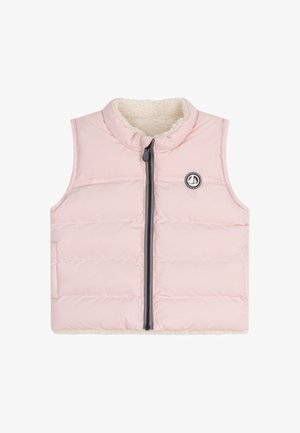 Rózsaszín ujjatlan mellény puha, krémszínű polár béléssel, steppelt mintázattal és elülső cipzárral. A mellkason kör alakú logó található.