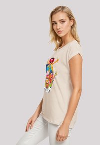 Beige, short-sleeve t-shirt featuring a colorful graphic of cartoon characters and musical instruments; cotton material, relaxed fit.