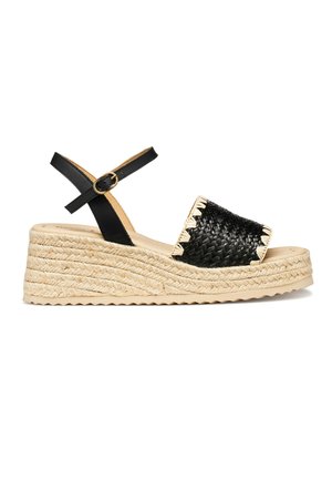 Sandalo espadrillas con zeppa con cinturino intrecciato nero sulla punta, cinturino con fibbia alla caviglia nero e suola piattaforma in juta naturale.