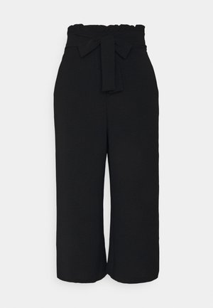 Pantaloni culotte neri con design a gamba larga, vita elasticizzata e dettaglio con fiocco annodato sul davanti. Tessuto morbido e strutturato.