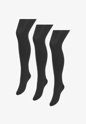 Három pár fekete, átlátszatlan harisnya lábujjtól a comb közép részéig, fehér háttér előtt bemutatva.