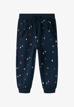 Granatowe spodnie dla malucha z wzorem serc w kolorach różowym, białym i czerwonym, elastycznym pasem ze sznurkiem, falbankowatymi przednimi kieszeniami oraz mankietami przy kostkach.