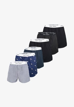 Set van zeven herenboxers in verschillende kleuren en patronen, waaronder strepen, een blauwe stof met een vogelprint en effen zwart. Elastische tailleband.
