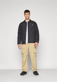 The North Face AFTERBURNER INSULATED - Jachetă outdoor - black/smokey brown