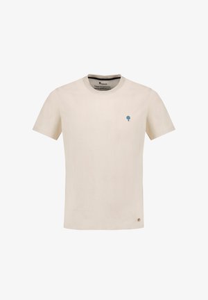 T-shirt beige chiaro a maniche corte realizzato in morbido cotone, con un piccolo logo di un albero blu sul lato sinistro del petto e un colletto rotondo.