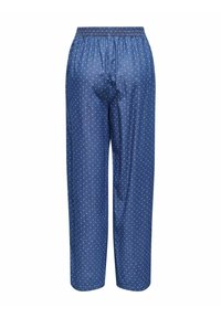 Niebieskie spodnie piżamowe wykonane z miękkiego materiału, z elastycznym pasem, ozdobione powtarzającym się białym wzorem w kropki. Luźny krój.
