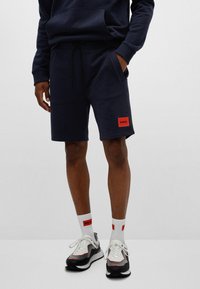 HUGO DIZ - Tracksuit bottoms - dark blue