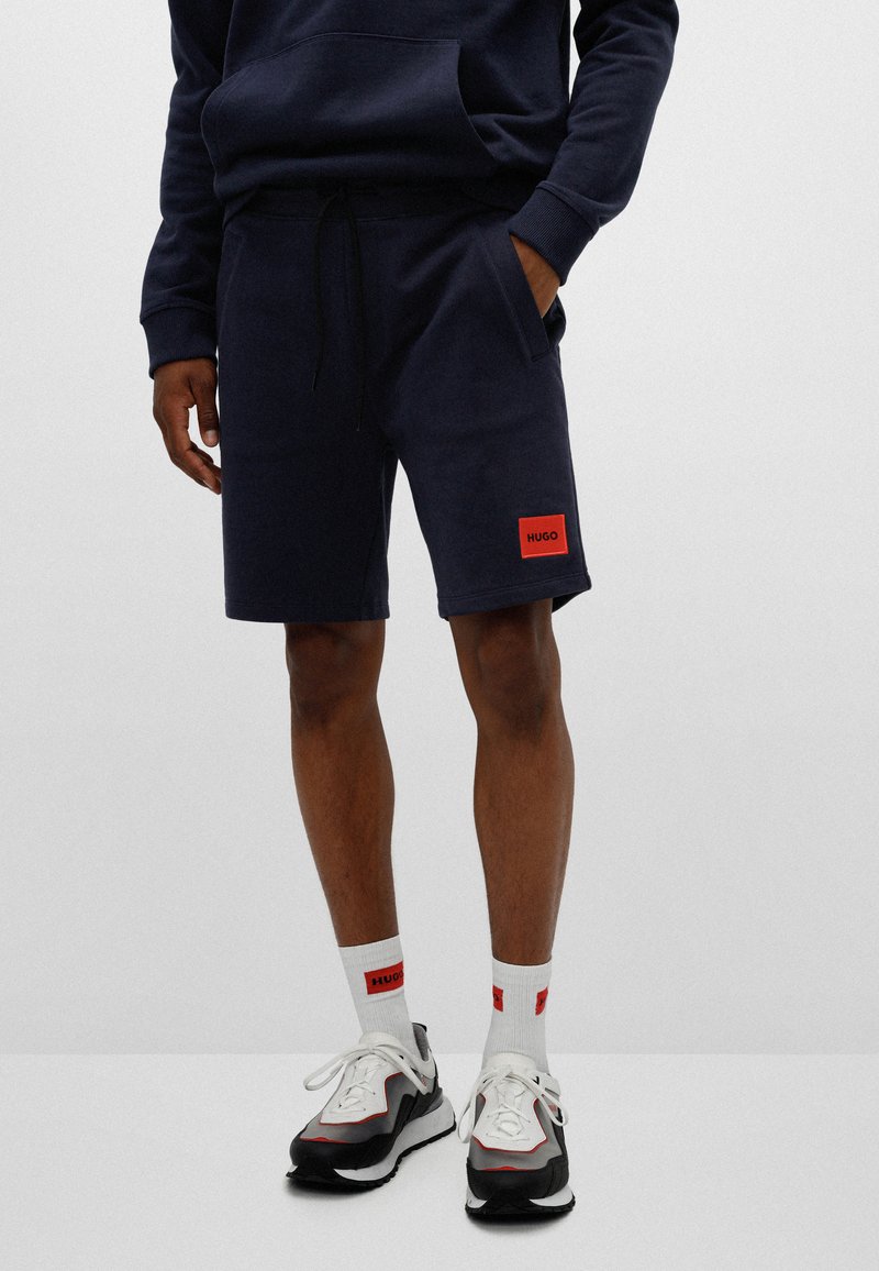HUGO DIZ - Tracksuit bottoms - dark blue