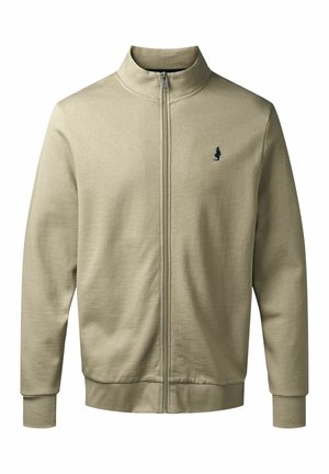 Helle beige Steppjacke mit hohem Kragen, gerippten Bündchen und Saum, mit einem kleinen dunklen Logo auf der linken Brust. Glatte Textur.