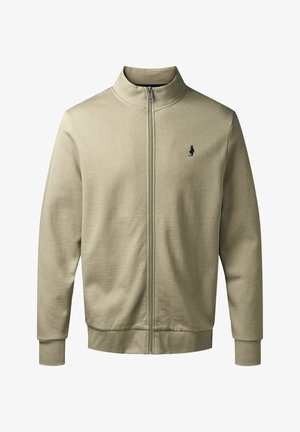 Jachetă crem deschis, cu fermoar, cu guler înalt, manșete și tiv ondulate, având un mic logo închis la culoare pe pieptul stâng. Textură netedă.