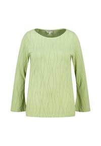 Lichtgroene lange mouw top met een gladde textuur en golvend ribbelpatroon, met een ronde halslijn en een ontspannen pasvorm.