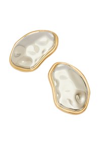 Hopeakuituista, orgaanimuotoisista korvakoruista, joissa on kiiltävät, heijastavat pinnat, joita reunustaa ohut kultakehys. Korviksissa on pehmeät kaaret ja hienovaraisia tekstuureja.