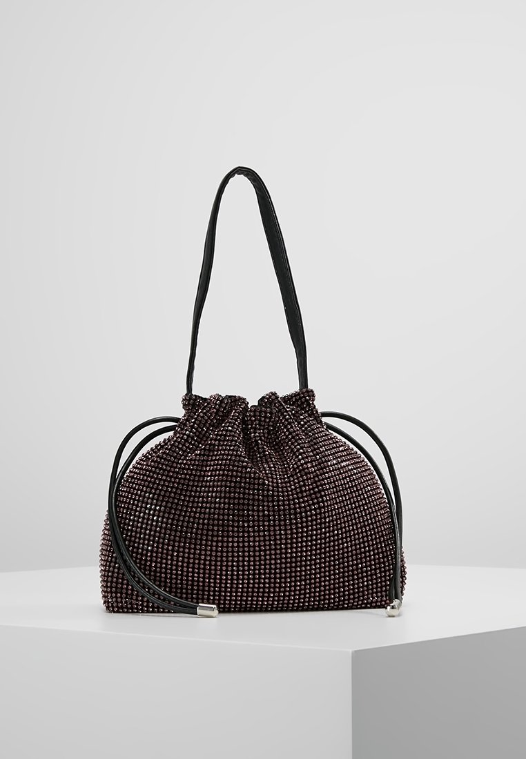 Beaded drawstring bag in dark purple with a soft texture, featuring black synthetic straps and silver-tone hardware accents.