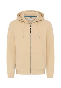 Felpa beige con zip, dotata di cappuccio regolabile, tasche a marsupio e polsini a coste. Realizzata in un tessuto morbido con una superficie liscia e dettagli minimi.