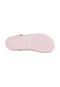 Pink rubber shoe sole with a textured surface featuring ridges and patterns. Designed for traction and comfort. Rounded shape with a smooth finish.