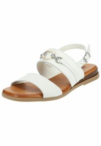Sandalo bianco in pelle con tre ampie cinghie, caratterizzato da un accento circolare in argento e beige. Suola sintetica marrone, pedana piatta.